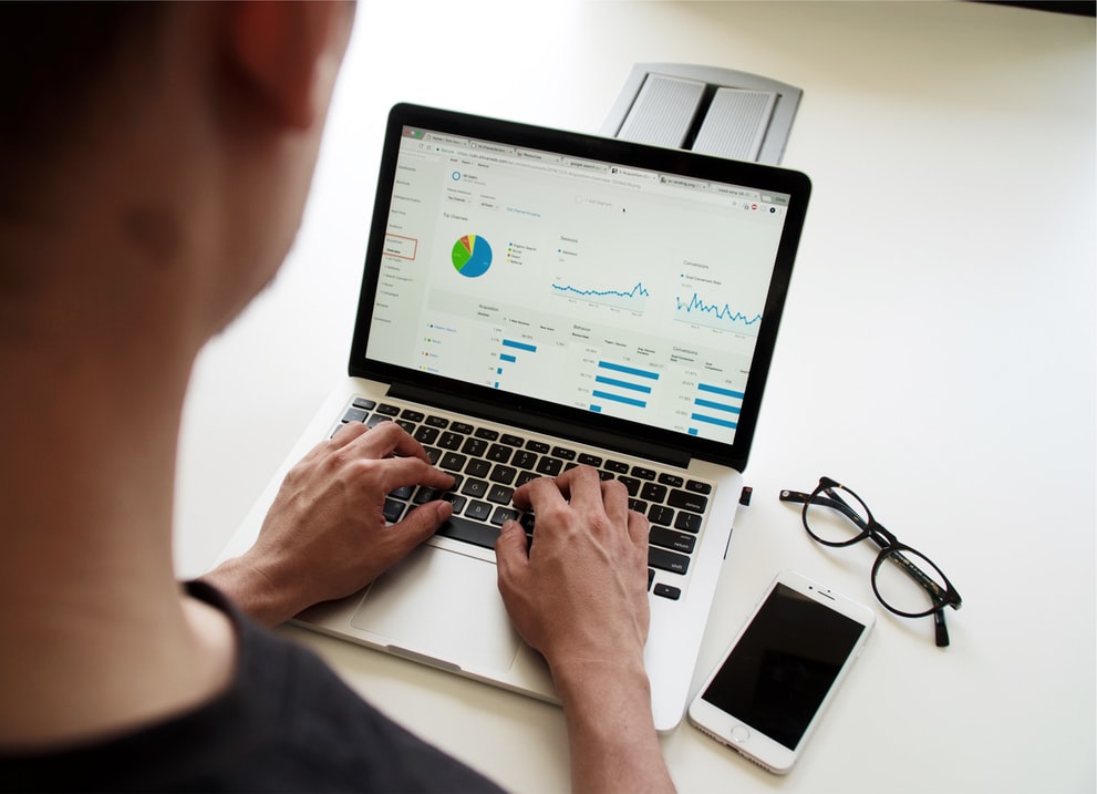 Numbers and graphs on a laptop screen.